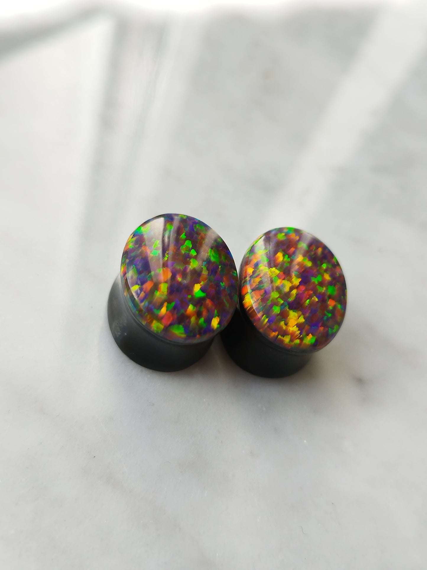 5/8" Oval Synthetic Opal And Obsidian Plugs